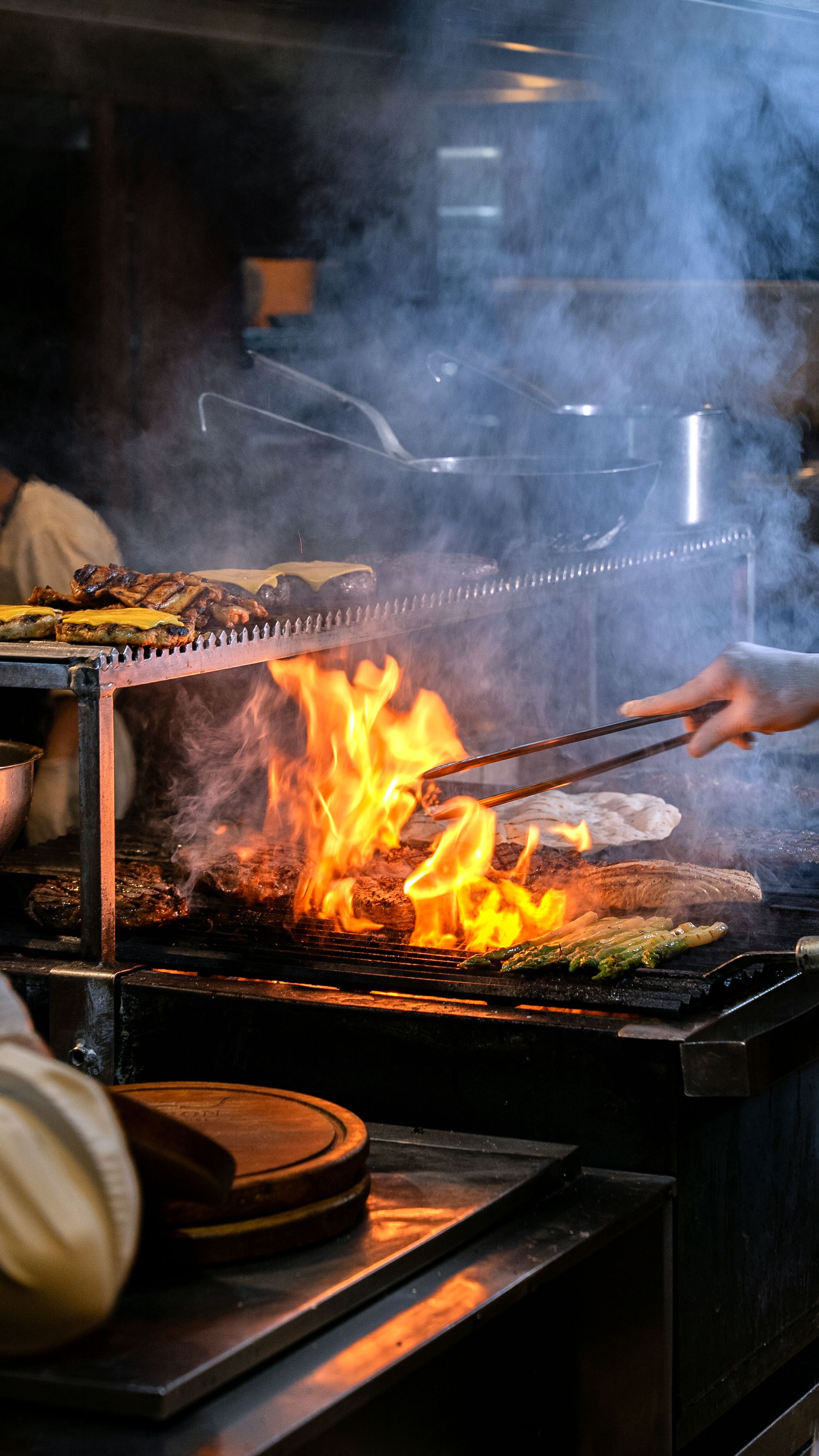 Live fire grill with vegetables and food cooking